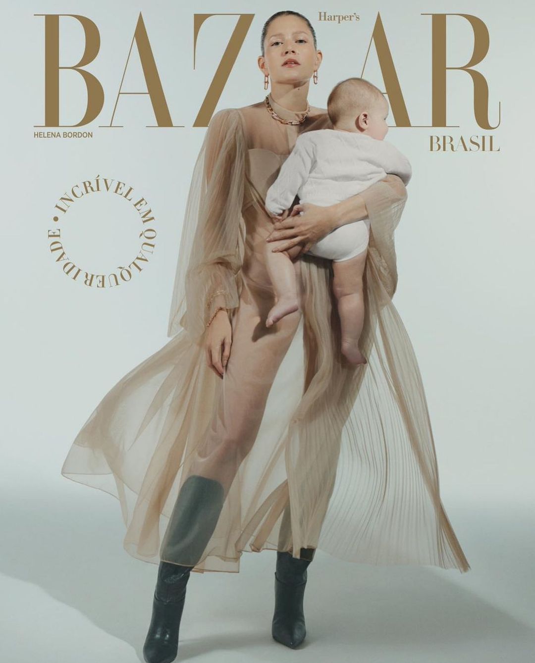 Pais corujas: Donata Meirelles e Nizan Guanaes tietam Helena Bordon, capa da Harper's Bazaar com o filho Humberto