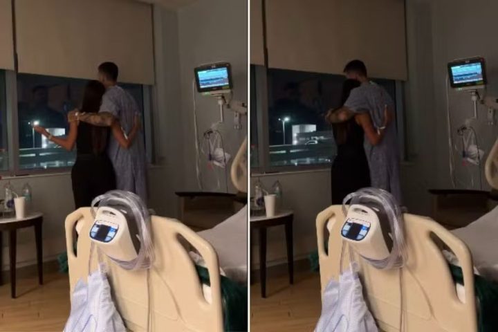 Em pé, Rodrigão abraça Adriana Sant’Anna em vídeo gravado no hospital