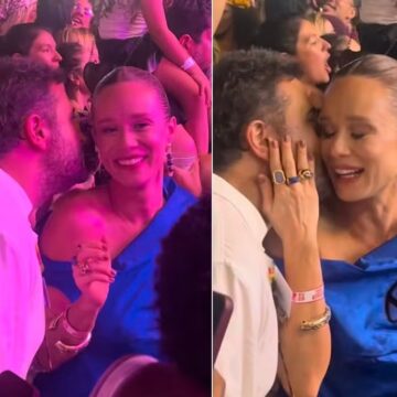 Solteira, Mariana Ximenes conversa ao pé do ouvido com rapaz durante Festival de Verão, em Salvador