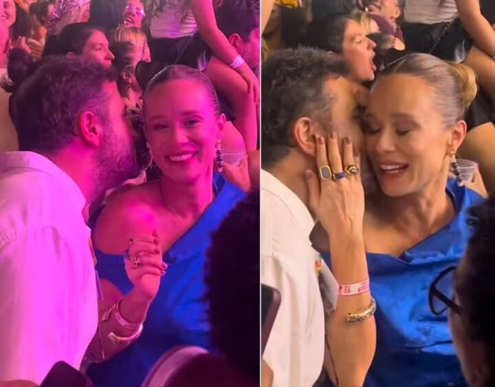 Solteira, Mariana Ximenes conversa ao pé do ouvido com rapaz durante Festival de Verão, em Salvador