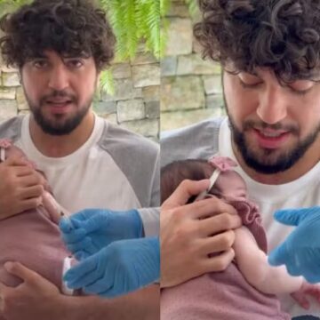 Zuza toma vacina no colo de Nattan, deixando Rafa Kalimann emocionada com o momento: ‘Tadinha’