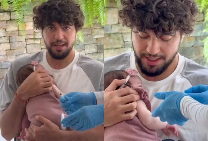 Zuza toma vacina no colo de Nattan, deixando Rafa Kalimann emocionada com o momento: ‘Tadinha’