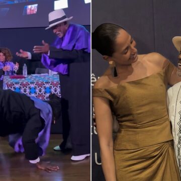 Lázaro Ramos beija os pés de Antonio Pitanga durante evento na UFRJ